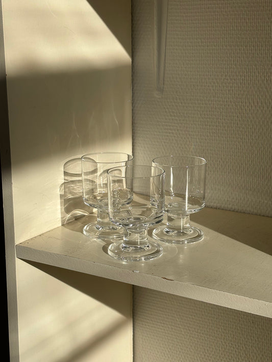 three minimalistic wineglasses