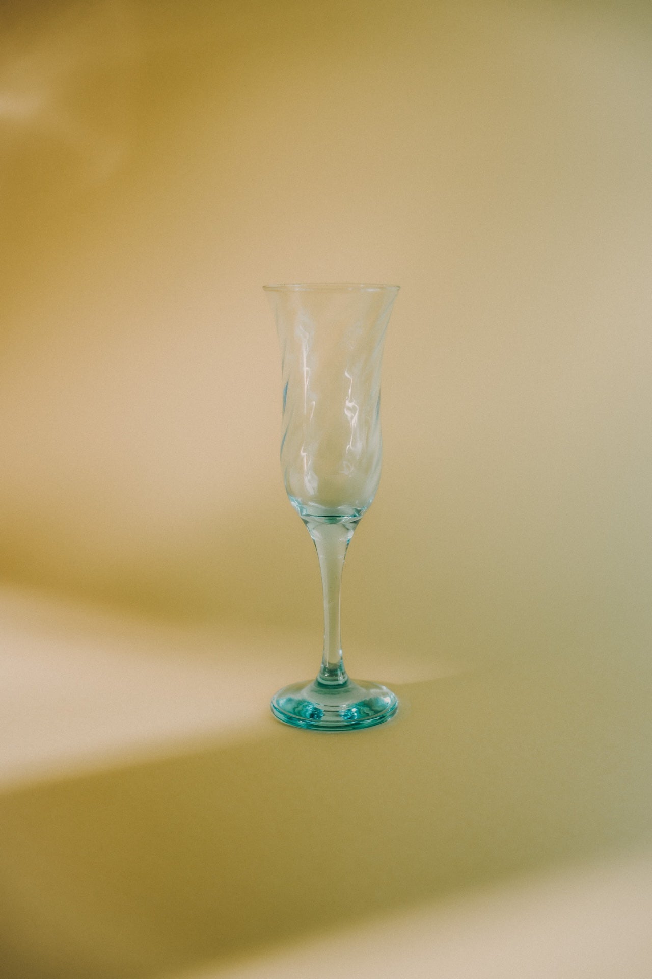 three blue swirled flutes