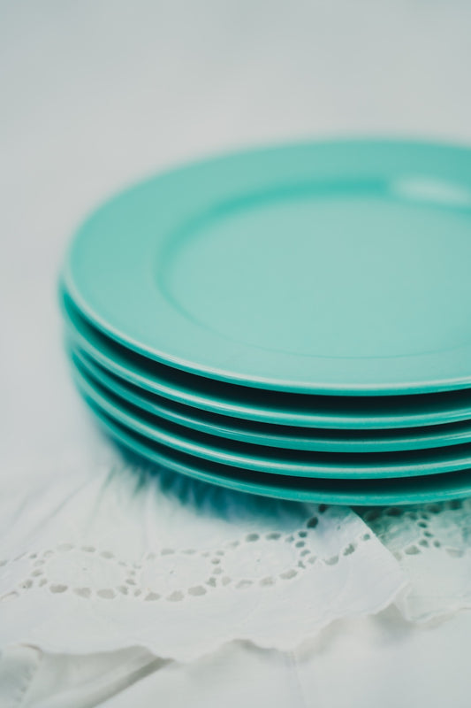 five turquoise plates