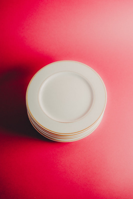 white plates with golden rim