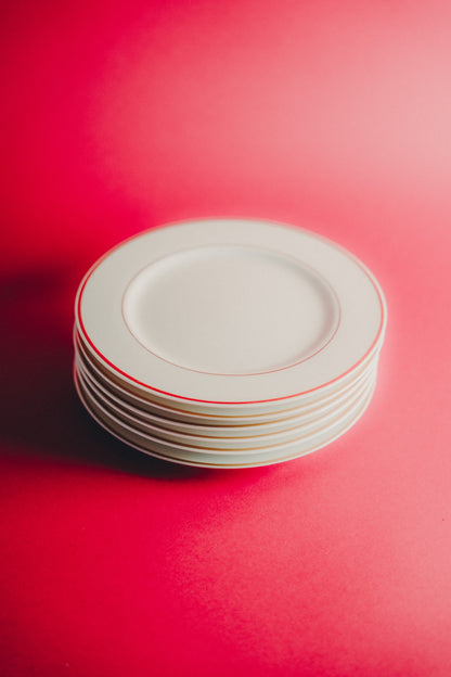 white plates with golden rim