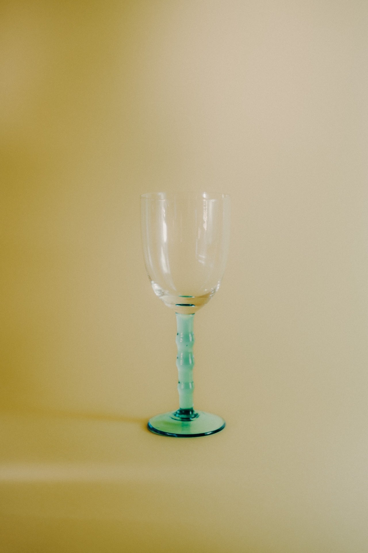 four blue wineglasses