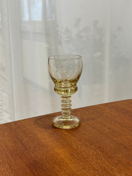 six yellow wineglasses