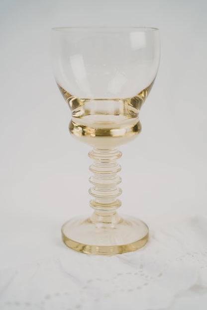 six yellow wineglasses